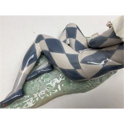 Lladro figure, Harlequin Reclining, modelled as a recumbent harlequin, no 5128, Sculpted by Salvador Furio, year issued 1982, year retired 1987, H28cm 