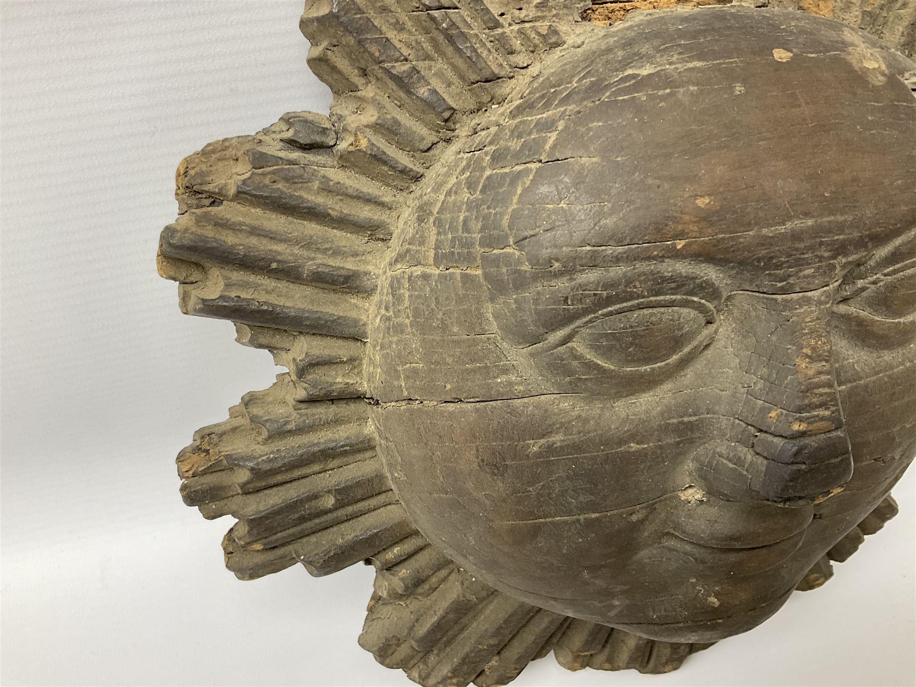 Carved pine mask of the sun, probably late 17th/early 18th century, originally a cresting, bearing Christie's lot labels, D20cm

Provenance 
Lot 161, Christopher Howe - The First Twenty Years, Christie's. 24th March 2004
