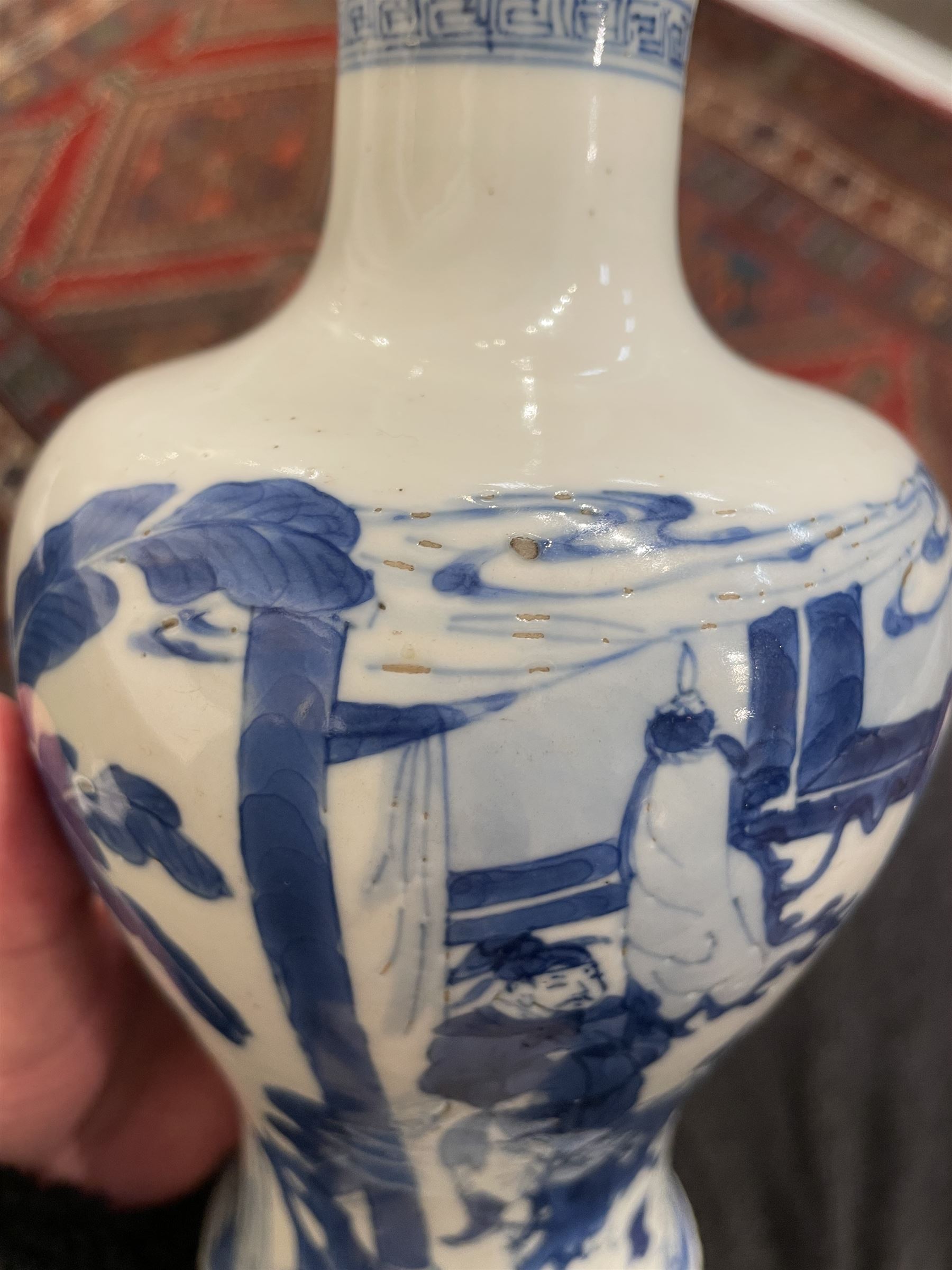 Chinese Kangxi porcelain vase, of baluster form painted in underglaze blue with seated figures and attendants, with fence, rockwork and leafy bamboo branches, with concentric circles mark beneath, H22.5cm