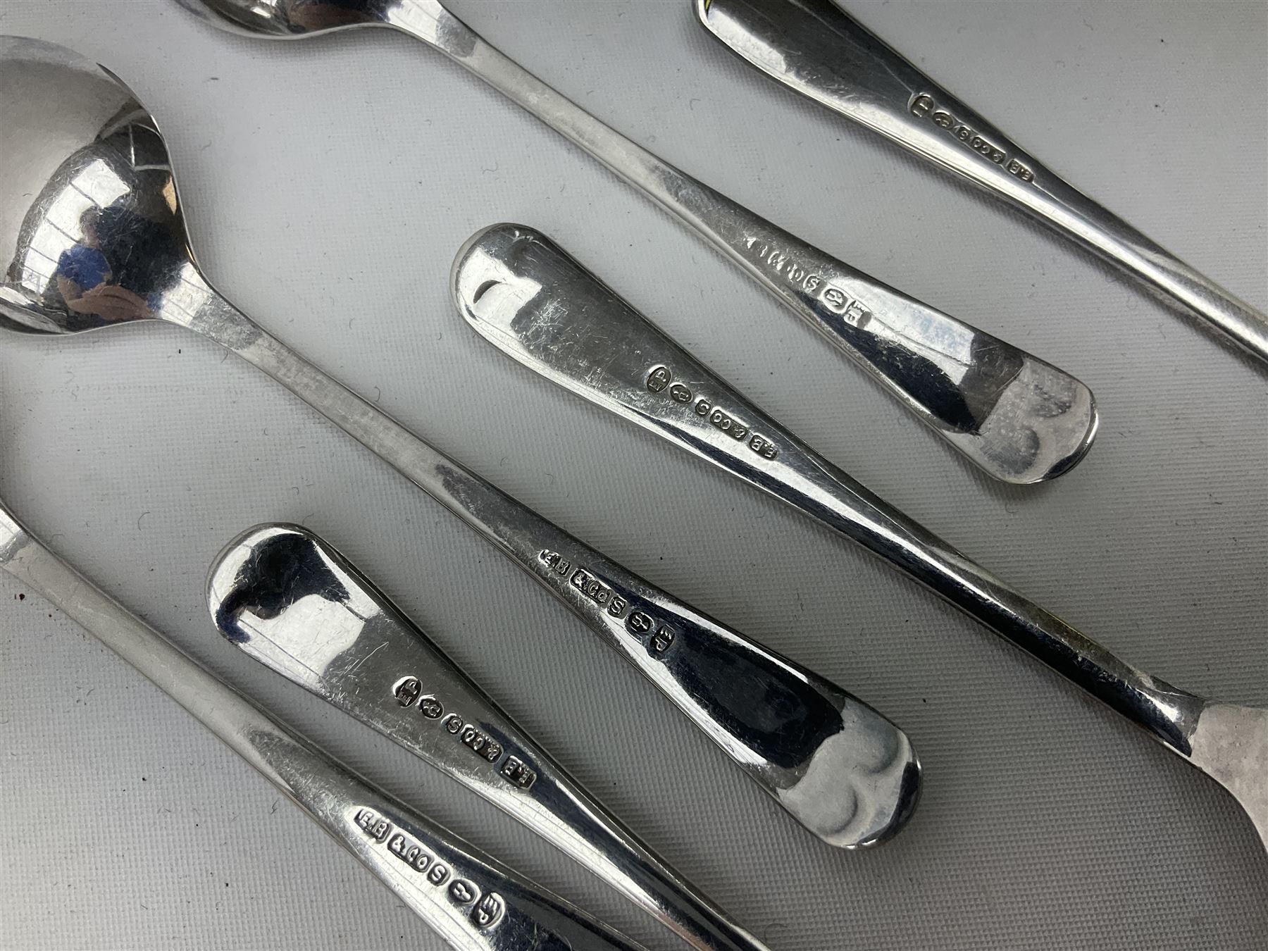 Set of three Yorkshire Miniature Rifle Association hallmarked silver and enamel fob medals, Birmingham 1925, 1926 & 1929; together with six silver plated coffee spoons each engraved with crossed rifles to the terminal (9)