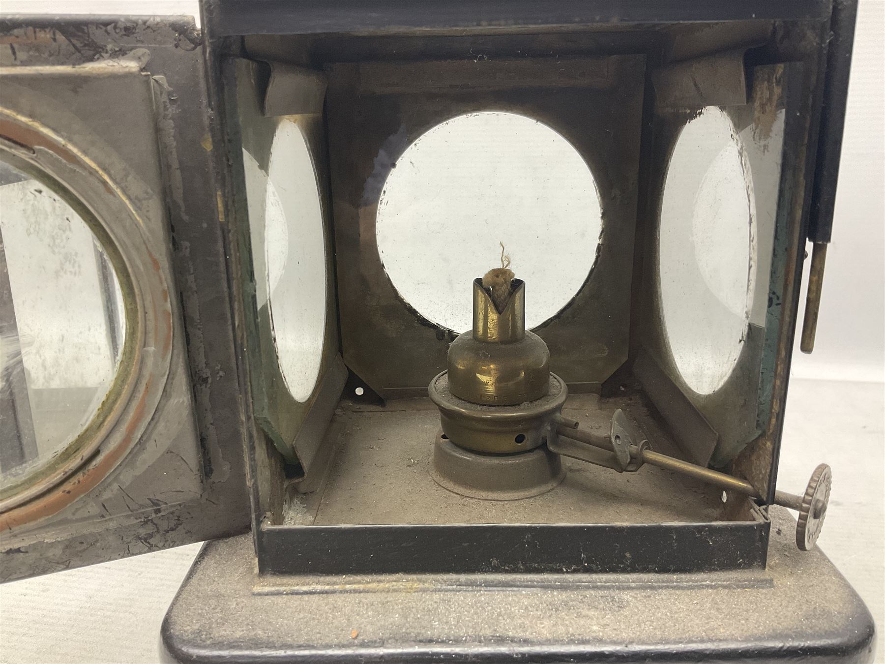 Railway interest - Lamp Manufacturing & Railway Supplies Ltd  Welch patent BR(E) lamp (M), with hinged copper upper section and hinged side door with maker's label, on square base H24cm; and another railway inspection type lamp (2)
