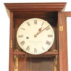 Edwardian mahogany regulator longcase clock, retailed by Maple & Co. Ltd., London, moulded cornice over glazed case enclosing a circular painted Roman numeral dial, single train weight-driven movement with brass cased weight and pendulum, on plinth base