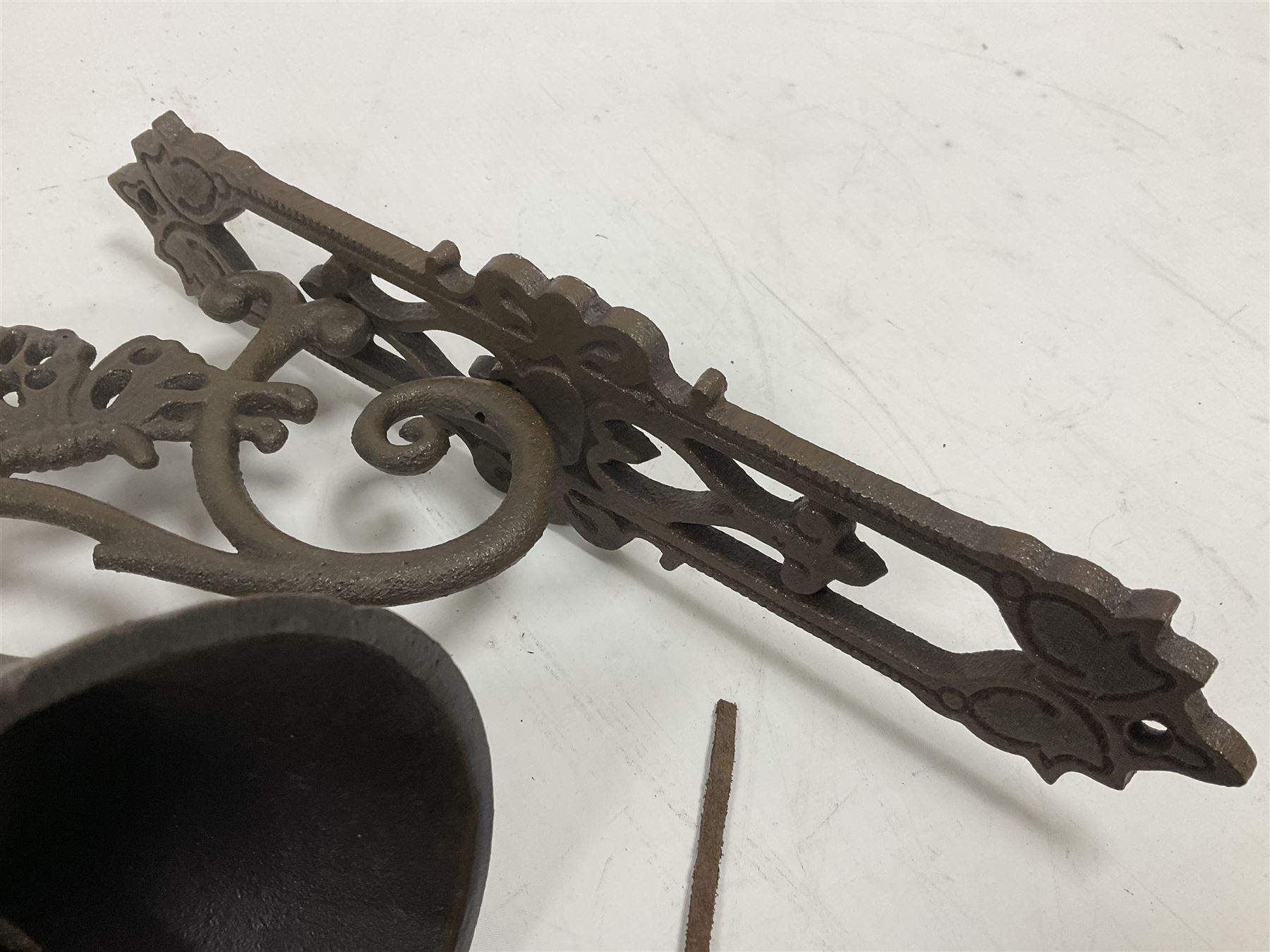 Cast iron exterior hanging garden bell with decorative butterfly bracket