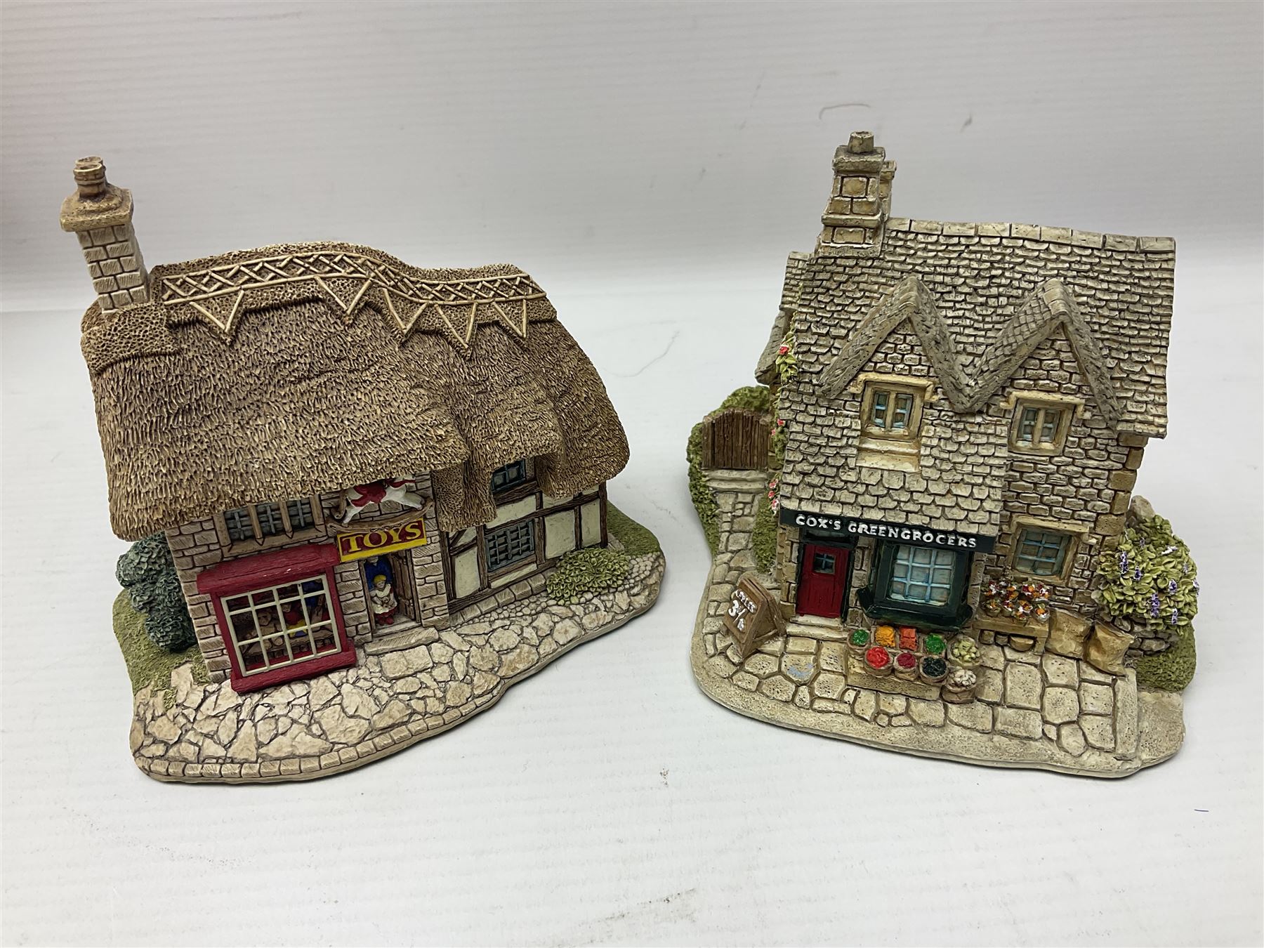 Thirteen Lilliput Lanes from the Shops Collection, including Apothecary, Horologist, China Shop, Penny Sweets, H Samuel etc, all with deeds and original boxes 