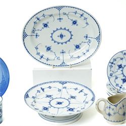 Royal Copenhagen onion pattern low comport, three breakfast cups and five saucers, oval platter, four tea plates, Munich 1972 Olympics plate, and four other blue and white items