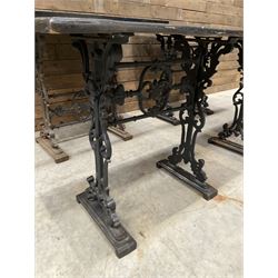 Four cast iron pub or bar tables with rectangular tops