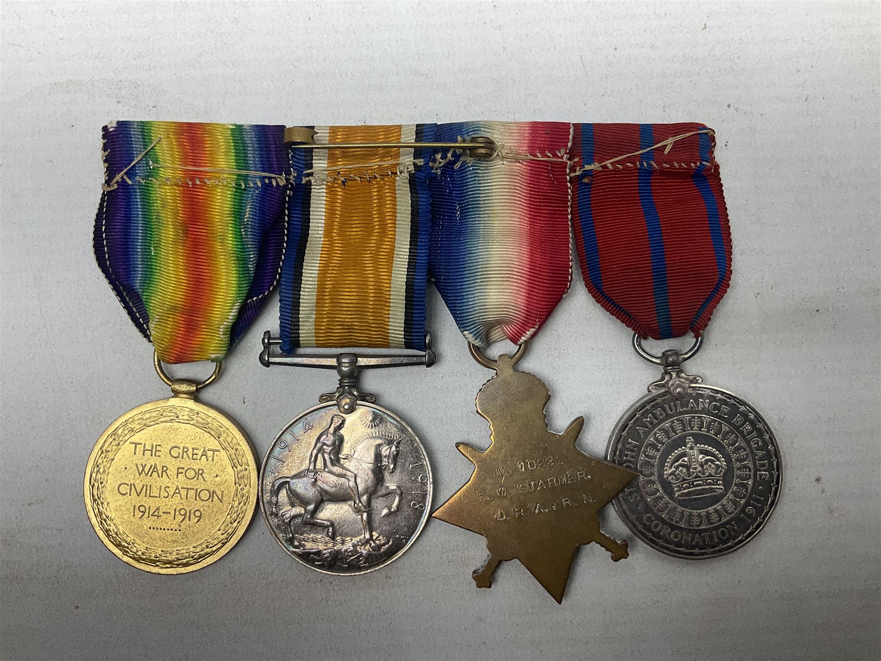 WW1 Naval group of four medals comprising British War Medal, 1914-15 Star and Victory Medal awarded to M.10222 E.W. Starmer J.R.A. (later S.R.A.) R.N.; and St. John Ambulance Brigade Coronation 1911 Medal to Pte. E.W. Starmer; all with ribbons
