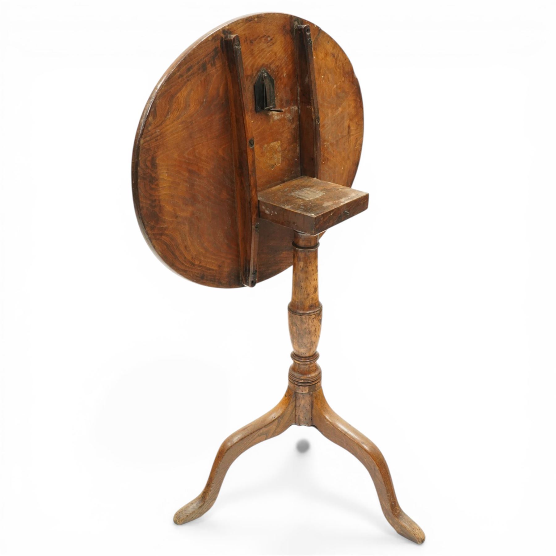 George III figured elm wine table with oval flip-top, raised on turned vasiform pedestal with tripod base