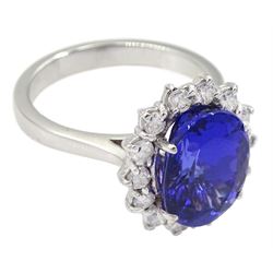 18ct white gold oval tanzanite and round brilliant cut diamond cluster ring, stamped 750, tanzanite approx 4.20 carat, total diamond weight approx 0.45 carat