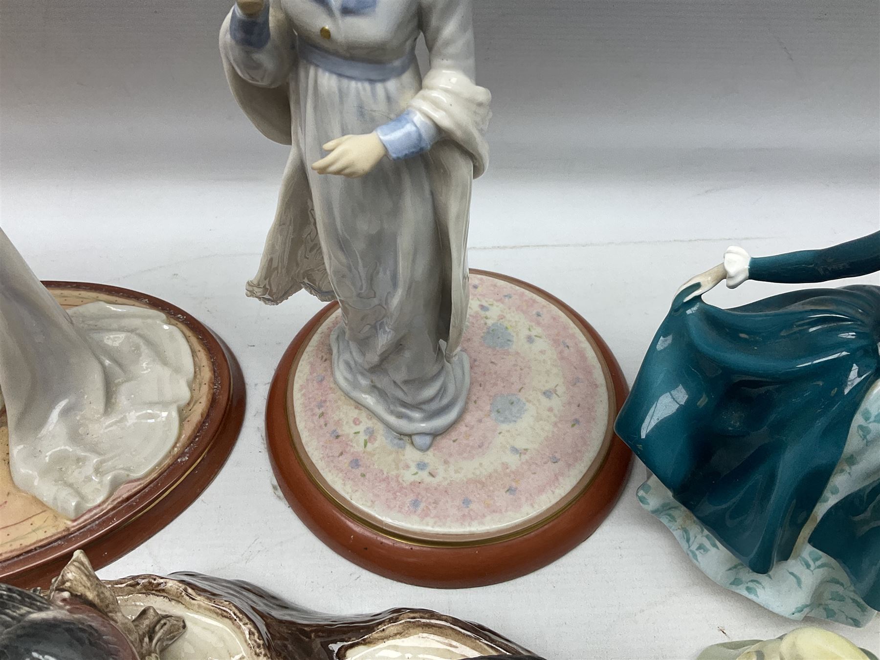 Nine Beswick bird figures, with stand, together with USSR thrush, two Franklin Mint Jane Austin figures and four Royal Doulton figures 