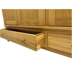 Corndell Furniture - light oak triple wardrobe, enclosed by three panelled doors, one long and one short drawer
