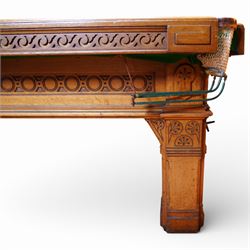 An outstanding bespoke late Victorian Aesthetic Movement golden oak full-sized snooker table of gothic influence, the rectangular slate bed covered in green baize within moulded rails and rounded pocket mounts, the protruding frame decorated with blind-fretwork frieze panels of Vitruvian scrolls and geometric ornament, over rails of repeating roundel carvings, raised on square chamfered and reeded supports with carved detail and panelled reserves, with further stylised brackets, stamped to the underside on all four edges R Anderson, serial number 4337
Viewing in situ near Tadcaster, please contact Chloe to arrange - 01904 393300