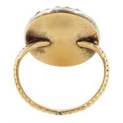 18th/ 19th century gold diamond portrait ring, set with an oval miniature of a woman on ivory, under a glazed panel, with old cut diamond surround and rope twist shank. This lot has been registered for sale under Section 10 of the APHA Ivory Act