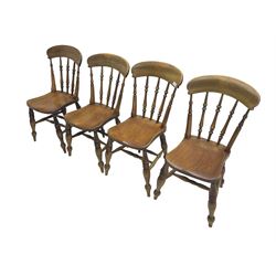 Four 19th century elm and beech farmhouse dining chairs, shaped cresting rail on spindle back, dished seat, on turned supports joined by double H stretcher base, the rear seat edge initialled 'A.S'
