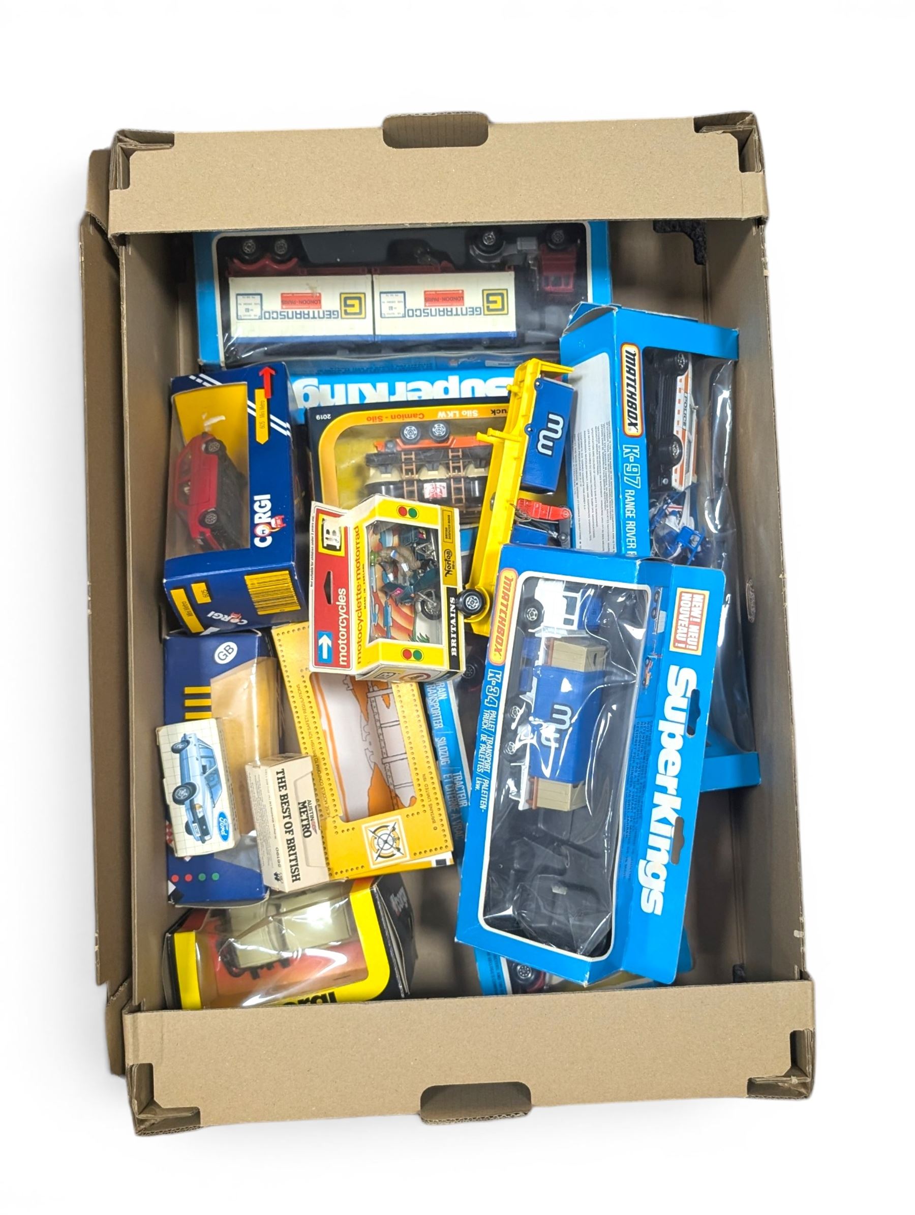 Collection of diecast model vehicles, including Matchbox Superkings K34 Pallet Truck (missing forklift), Matchbox Superkings K97 Range Rover Police, Corgi Super Silo Truck, Matchbox Superkings K17 Container Truck, Matchbox Superkings K3 Grain Transporter, Britains 9672 British Despatch Rider, Corgi Ford Escort and a Corgi Austin Metro, all boxed and Matchbox K33 Cargo, unboxed