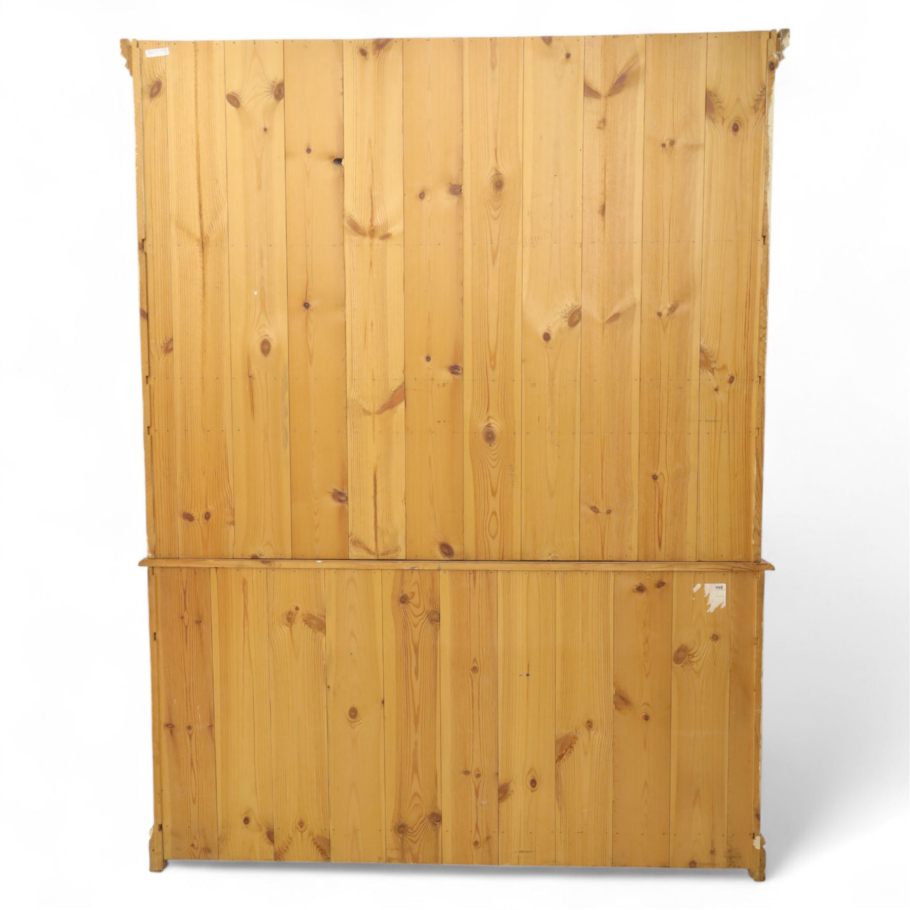 20th century painted pine dresser, moulded cornice above shaped frieze and two open plate shelves, central row of five small drawers with wooden knobs, base fitted with three drawers over a pair of panelled cupboard doors, on shaped plinth base