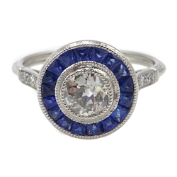  Platinum round old cut diamond and calibre cut sapphire target ring, with diamond shoulders, central diamond approx 0.85 carat  