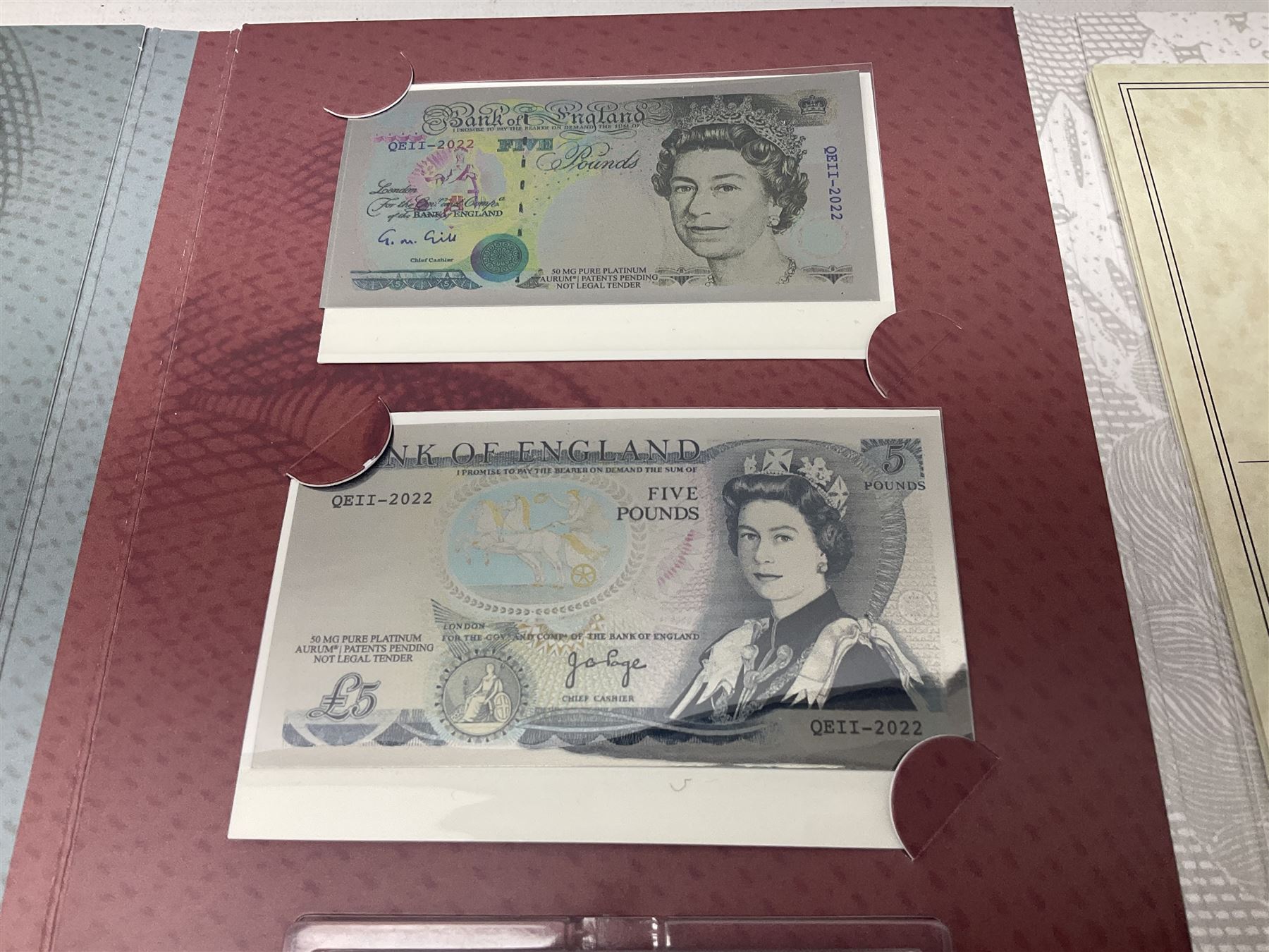 Queen Elizabeth II 'The Platinum Jubilee Banknote Collection' including 2022 'The Unissued Fifty Pence Banknote Gold Coin', housed in official card folder with certificates