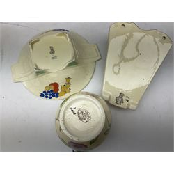 Group of Art Deco ceramics, comprising Wadeheath jug painted in spiralled bands of blue, orange, yellow and brown, shape no. 707784, Royal Doulton Caprice pattern twin handled bowl, no. D5358, Arthur Wood wall pocket of typical stylised fan form with painted floral decoration, Arthur Wood vase of cornucopia form with red and grey floral decoration, Wadeheath jug of ribbed form with stylised handle, and two Hancock's Ivory Ware jugs, tallest example H26cm