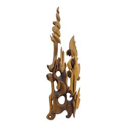 Helen Skelton (British 1933 – 2023): Large abstract wooden wall sculpture, H175cm, W53cm. Born into an RAF family in 1933 in Kent and travelled the world extensively during her childhood. After settling in Bridlington, Helen immersed herself in painting, textiles, and wood sculpture, often inspired by nature's beauty. Her talent was showcased in a one-woman show at Sewerby Hall and recognised with the sculpture prize at Ferens Art Gallery in 2000. Sadly, Helen’s daughter passed away from cancer in 2005. This loss inspired Helen to donate her sculptures to Marie Curie upon her passing in 2023.