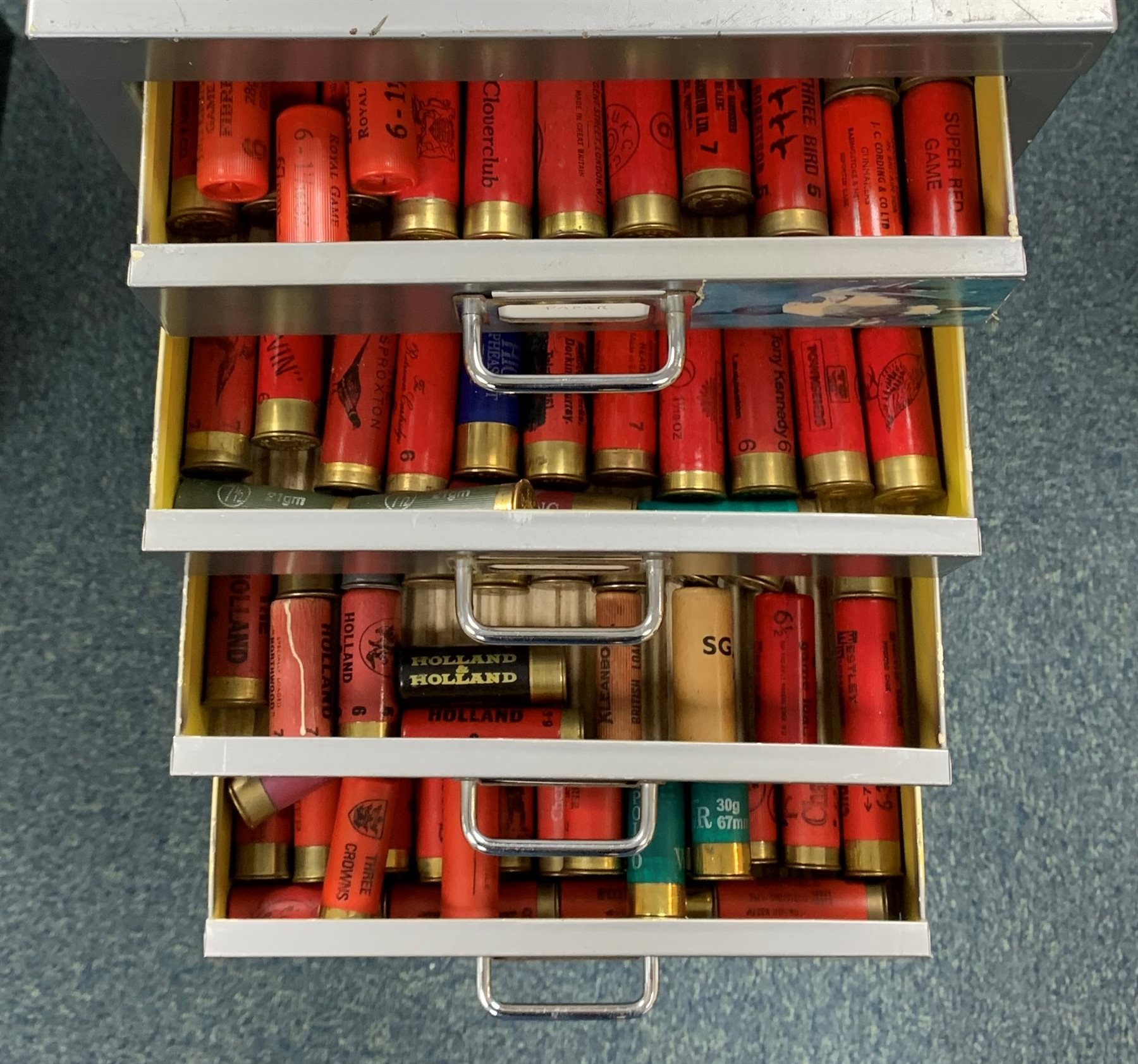 Approximately nine hundred shotgun cartridges, various ages, gauges and makers, contained in grey steel fifteen-drawer cabinet W28cm H94cm D41cm SHOTGUN CERTIFICATE REQUIRED