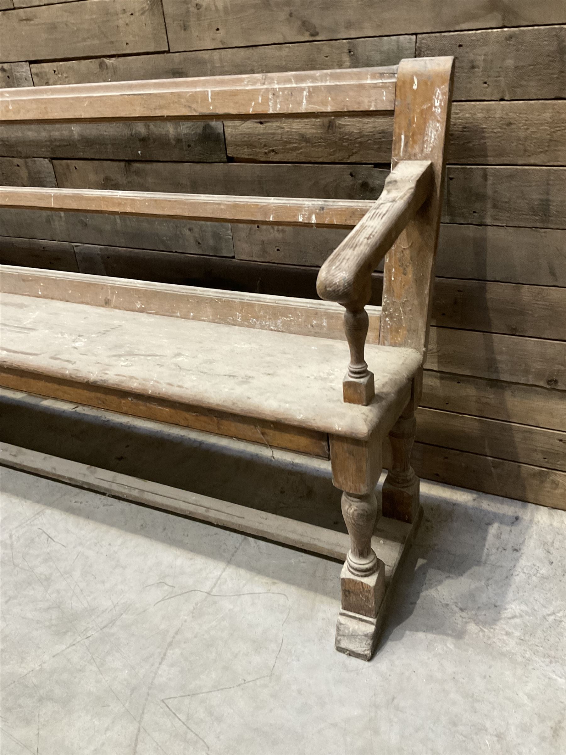 Victorian pitch pine bench pew, turned arms and legs, rail back with plank seat, 274cm