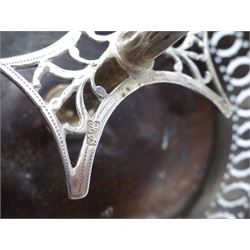 Late 18th century silver cruet stand, of oval form, with pierced sides upon four bun feet, hallmarked to handle Hester Bateman, all other hallmarks indistinct, together with five matched silver mounted cut glass cruet bottles, including some later Victorian examples, hallmarks predominantly indistinct, stand H20cm