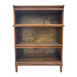 Globe Wernicke - early 20th century mahogany three-tier stacking library bookcase, three glazed sections enclosed by hinged and sliding doors, interior with transfer label, raised on cabriole front supports