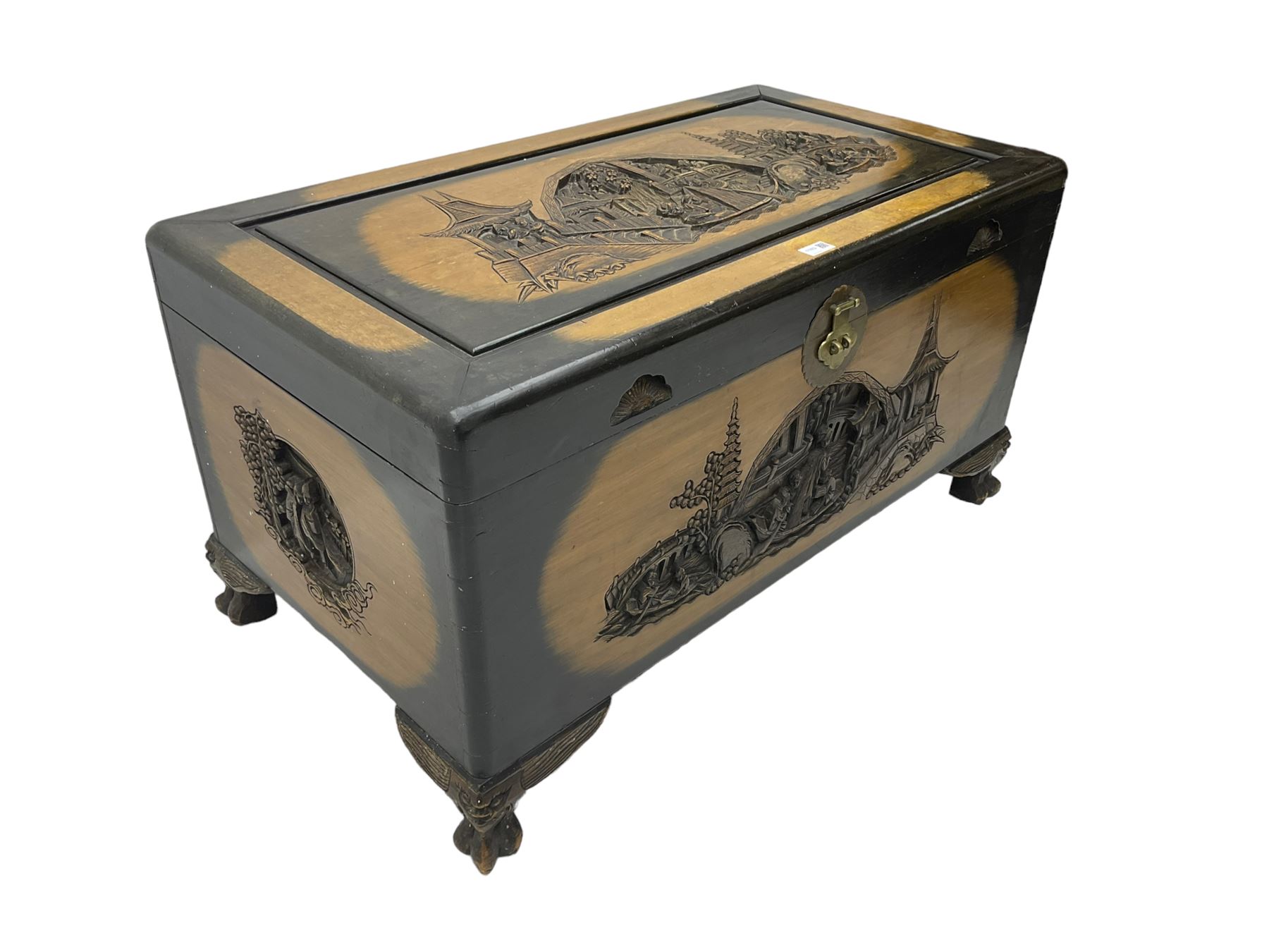 Singapore camphor wood blanket chest, rectangular hinged top with carved panel depicting traditional pagoda and river scenes