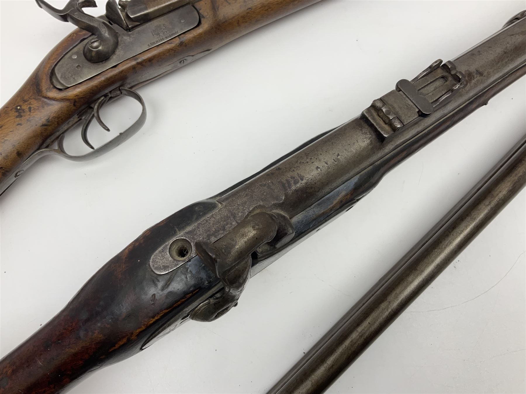 19th century Indian .577 Enfield muzzle loading rifle, proofed for 26-bore, the 98.5cm barrel with three barrel bands and later ram rod L140cm overall; 19th century Belgian side-by-side double barrel percussion shotgun, approximately 20-bore, with 74cm barrels and studded walnut stock, lock plate marked 'Liege 1868' and 'V. Gulikers-Maquinay' L117cm overall; and another side-by-side double barrel shotgun by Smythe with underlever opening (3)