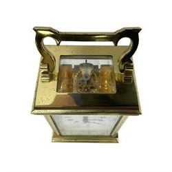 English - late 20th century 8-day carriage clock by Taylor & Bligh, in an Anglaise case with a rectangular handle, bevelled glass panels and enamel dial with Roman numerals, minute markers and steel moon hands, timepiece spring driven movement with a jewelled lever platform escapement. With key.