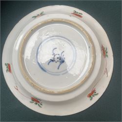 Three Chinese famille verte examples, approximately Yongzheng period, to include two teabowls and two saucers, each decorated with flowers and butterflies, two with sacred fungus mark within double rings, the teabowl with lotus mark, the other indistinct - possibly a Wan mark within lozenge (4)