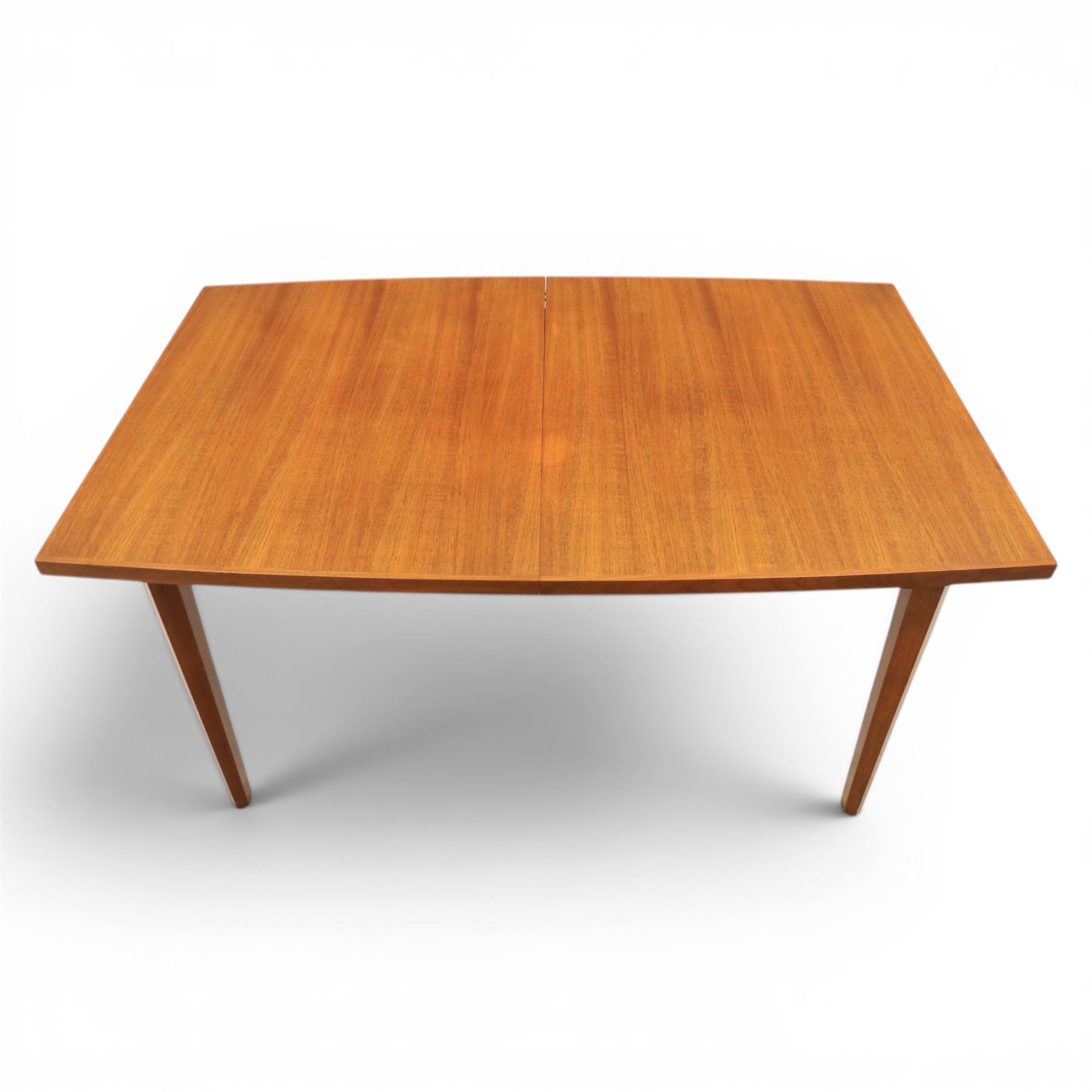 Mid-20th century teak dining table and chairs, with stowable fold over leaf, raised on square tapering legs, the chairs with teak frames and reupholstered green leather seats