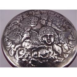 Modern red leather jewellery box, of circular form, the silver mounted removable cover repousse decorated with a cherub choir, opening to reveal a tan suede lined interior, hallmarked Douglas Pell Silverware, London 1990, D16.5cm 