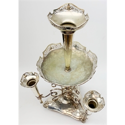 Large James Deakin and Sons silver plated epergne, c.1900, the central trumpet with pierced rim, above a large shallow bowl, upon a reeded column supporting three scrolling branches with conforming smaller trumpets, raised upon a triangular pierced base with three scroll feet, with marks beneath, JD & S, EPNS , and 'desk bell', T9518, H69cm