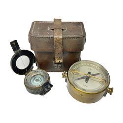 WWII British marching compass, the black lacquered brass case inscribed T.G.Co.Ltd. No.B100228 (broad arrow) 1941 Mk.III; and a ship's brass cased clinometer, the silvered dial marked R(arrow)L, D9cm; in leather carrying case (2)