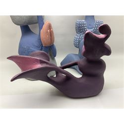 Helen Skelton (British 1933 – 2023): Three carved wooden abstract sculptures, one modelled stylized bird, painted in blue and pink tones, largest H51cm. Born into an RAF family in 1933 in Kent and travelled the world extensively during her childhood. After settling in Bridlington, Helen immersed herself in painting, textiles, and wood sculpture, often inspired by nature's beauty. Her talent was showcased in a one-woman show at Sewerby Hall and recognised with the sculpture prize at Ferens Art Gallery in 2000. Sadly, Helen’s daughter passed away from cancer in 2005. This loss inspired Helen to donate her sculptures to Marie Curie upon her passing in 2023.
