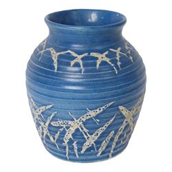 Quentin Bell 1910-1996: ribbed vase with fluted rim, decorated in white abstract design on a blue ground, signed Bell beneath, H16cm 