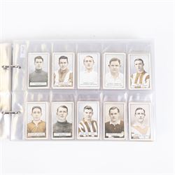 Collection of Edwardian and later Football related trading and cigarette cards, including forty-nine of fifty 1906 Ogden's Football Club Colours, 1922 PALS Footall series, ninety of one hundred 1925 Gallaher Famous Footballers, complete set of forty-four 1926 Ogden's Captains of Association Football Clubs and Colours, complete set of fifty 1927 Players Football Caricatures by MAC,  complete set of fifty 1927 Players Football Caricatures by RIP,  complete set of fifty 1930 Players Association Cup Winners, complete set of 50 1933 Ogdens AFC Nicknames etc, housed in brown cigarette card album