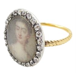 18th/ 19th century gold diamond portrait ring, set with an oval miniature of a woman on ivory, under a glazed panel, with old cut diamond surround and rope twist shank. This lot has been registered for sale under Section 10 of the APHA Ivory Act