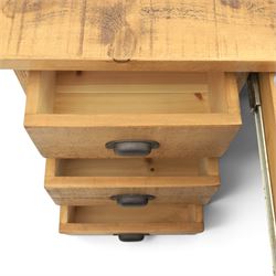 Indigo Furniture - rustic oak twin pedestal desk, rectangular plank top, with central frieze drawer, the fixed pedestals with three drawers and metal cup handles, raised on a plinth base