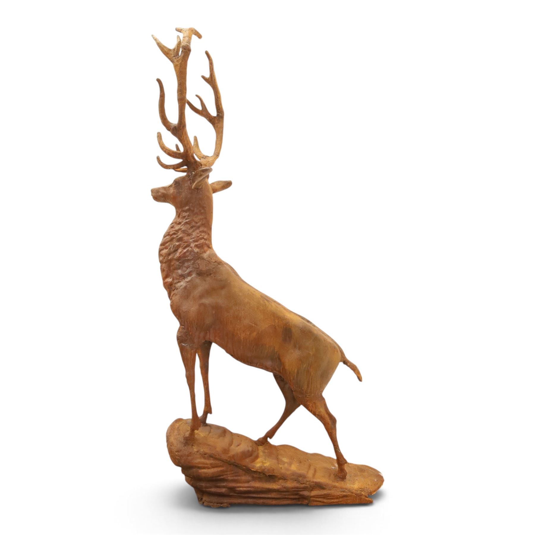 Pair of cast iron stags, upon a on moulded rocky plinth, standing alert 
