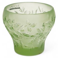 Lalique green glass tea light holder decorated with the coriandre pattern H8cm, another in the basil pattern H8cm and another with trailing leaves H8cm, all signed 'Lalique, France'