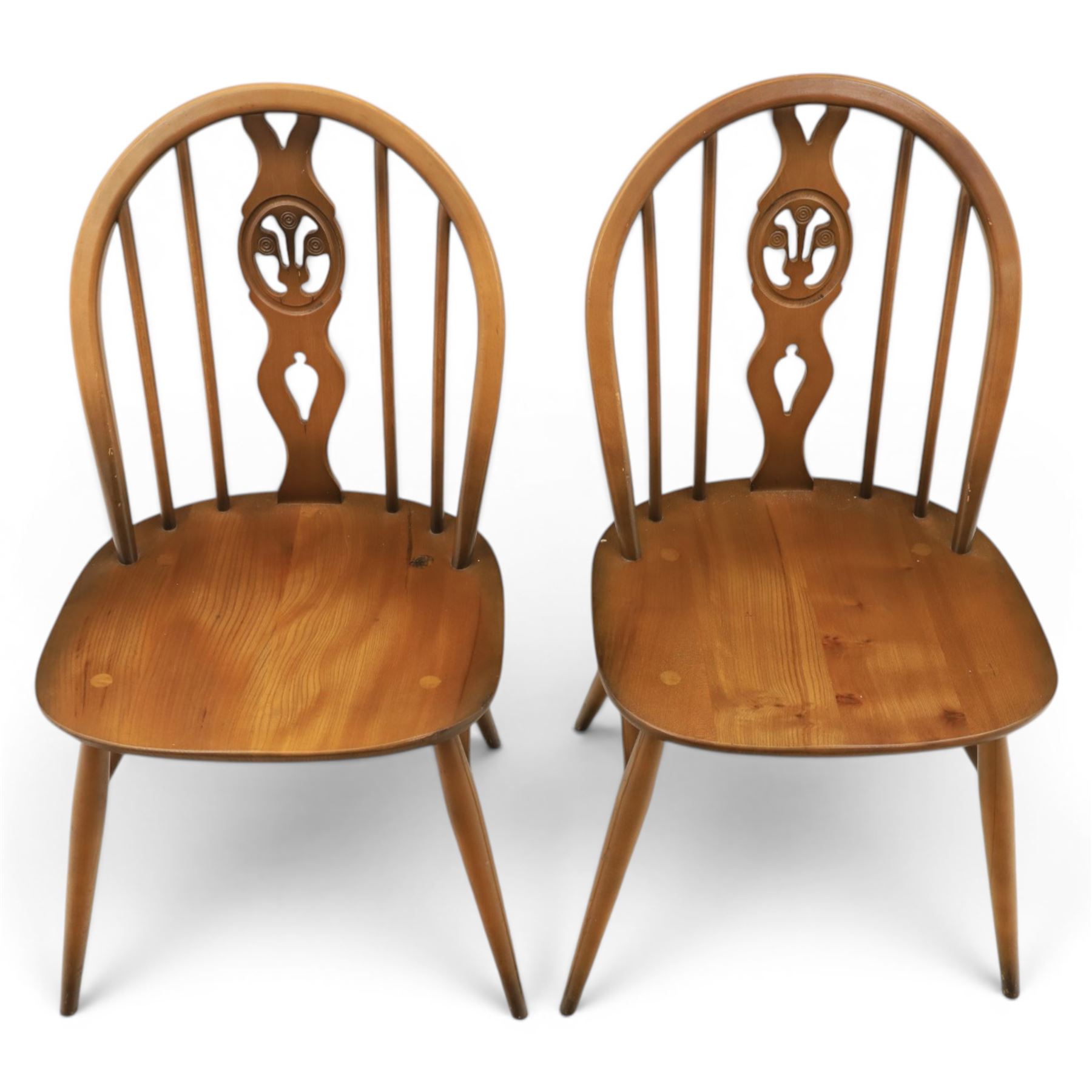 Ercol - Set of four dark elm 'Fleur De Lys' chairs