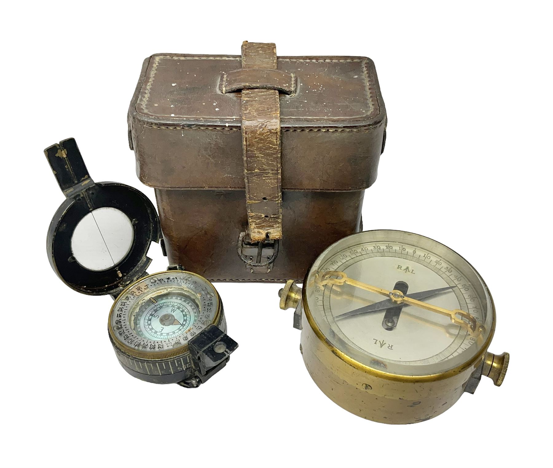 WWII British marching compass, the black lacquered brass case inscribed T.G.Co.Ltd. No.B100228 (broad arrow) 1941 Mk.III; and a ship's brass cased clinometer, the silvered dial marked R(arrow)L, D9cm; in leather carrying case (2)