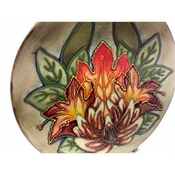 Moorcroft dish, decorated in the Flame of the Forest pattern designed by Philip Gibson, with impressed and painted marks beneath, including date symbol for 1999, D16cm.