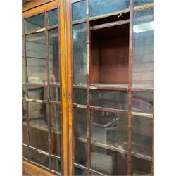 19th century mahogany bookcase on cupboard, fitted with two astragal glazed doors enclosing three shelves, above two cupboards, on skirted base