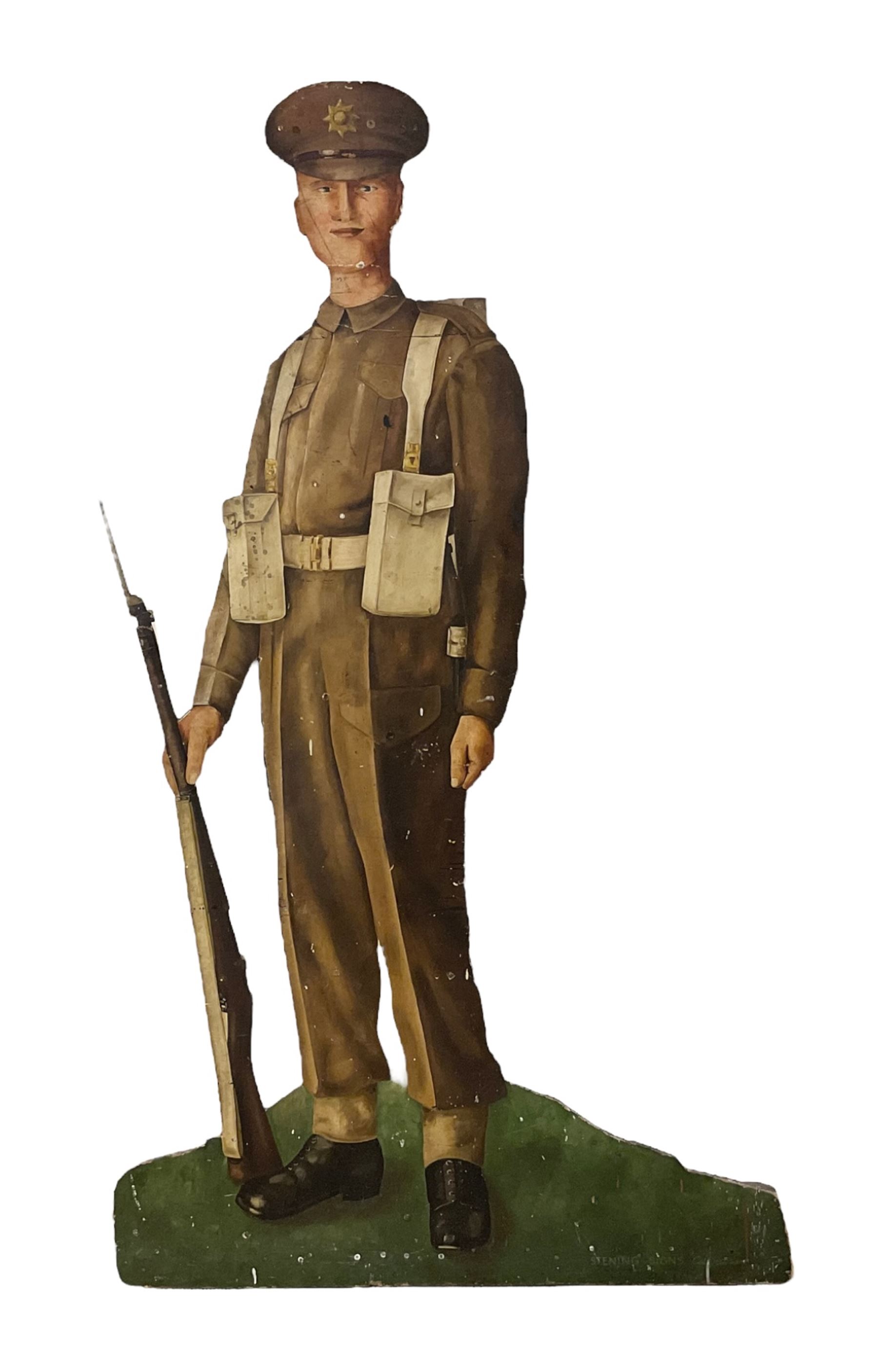 Military Outfitters hand painted life size wooden cut out figure of a WW1 soldier standing at ease holding a gun by his side, marked Stening Signs; hardboard on planked frame H199cm