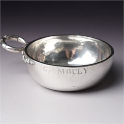 French silver tasse de vin with Minerva's head and makers mark J.P. with an anchor, the rim engraved C Mouly, Spanish tasse de vin inset with a silver coin and two other tasse de vin (4)