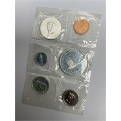 Mostly Canadian coins including 1967 six coin set, various Canadian 50 cent coins, various nickels, Royal Canadian Mint 1990 specimen coin set in blue folder with outer sleeve, various Canadian dollars etc, in folders and loose